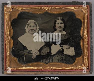 Portrait of Two Seated Women, 1855-1860.  Additional Info: Elderly woman at left holding book; younger woman at right with arms crossed. Stock Photo