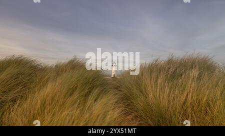 Talacre Lighthouse at Point of Ayr on the North Wales coast, a historic lighthouse surrounded by sand dunes and beach. Stock Photo
