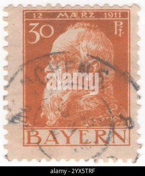 BAVARIA — 1911 March 10: 30 pfennig orange-buff on buff postage stamp depicting portrait of Prince Regent Luitpold at 90 anniversary. Luitpold Karl Joseph Wilhelm Ludwig, Prince Regent of Bavaria (12 March 1821 – 12 December 1912), was the de facto ruler of Bavaria from 1886 to 1912, as regent for his nephews, King Ludwig II and King Otto. His regency arose due to his nephews' mental incapacity Stock Photo