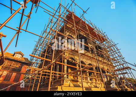 Scaffolding around Krishna Mandir, Durbar Square, Patan, Nepal, damaged during the 2015 earthquake Stock Photo