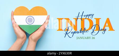 Female hands with heart in colors of Indian flag on light blue background. Greeting banner for India Republic Day Stock Photo