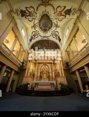 The main altar at the Cathedral-Basilica of St. Louis King of France in New Orleans, Louisiana. This Roman Catholic church is adorned with statues, ce Stock Photo