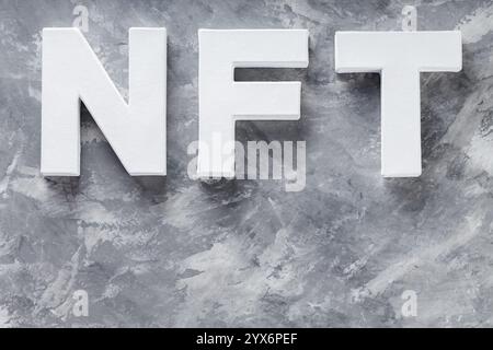 Non-Fungible Token on Gray Concrete Background, Top View Stock Photo