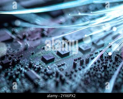 Data transfer, conceptual image. Fibre optics and circuit board. Stock Photo