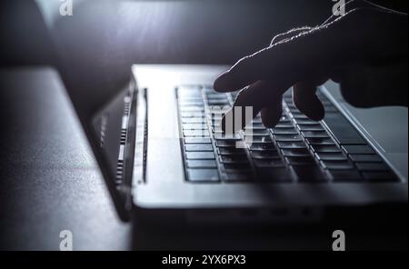 Man working on a laptop computer. Stock Photo