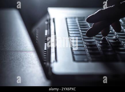 Man working on a laptop computer. Stock Photo