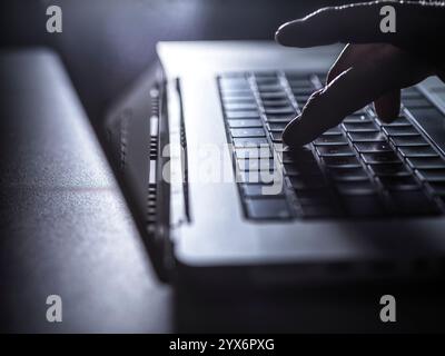Man working on a laptop computer. Stock Photo