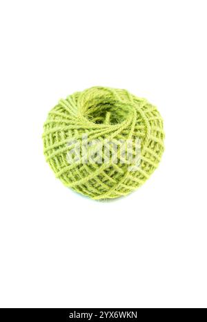 A roll of green jute twine placed on a white background, ideal for crafting, packaging, and DIY projects. Perfect for online stores or product catalog Stock Photo