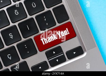 Top view of Thank You text on red button on laptop keyboard Stock Photo