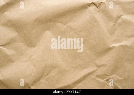 Wrinkled recycled paper background covering the entire frame Stock Photo