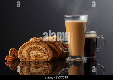 Dessert with walnuts and coffee on a black reflective background. Cake with brown sugar, walnuts, and cream. Copy space. Stock Photo