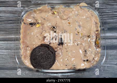 Cairo, Egypt, November 25 2024: Oreo creamy cold cookie pieces with a sweet fondant filling with whipped cream and chocolate ice cream, with pieces of Stock Photo