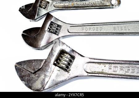 Different sizes of adjustable wrenches, hand tools include wrenches, pliers, cutters, files, striking tools, struck or hammered tools, screwdrivers, v Stock Photo