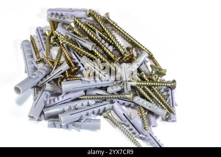 Screws and plugs used weith hand tools, hand tools include wrenches, pliers, cutters, files, striking tools, struck or hammered tools, screwdrivers, v Stock Photo