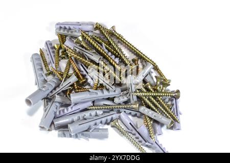 Screws and plugs used weith hand tools, hand tools include wrenches, pliers, cutters, files, striking tools, struck or hammered tools, screwdrivers, v Stock Photo