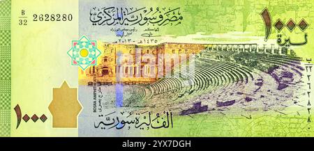 Large fragment of the obverse side of One Thousand Syrian pounds banknote issued by the central bank of Syria 2013, features Bosra amphitheater, Syria Stock Photo