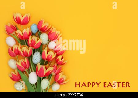 Happy Easter background with eggs, red and yellow tulip flower bouquet and text. Floral arrangement for greeting card, label, gift tag, menu. Stock Photo
