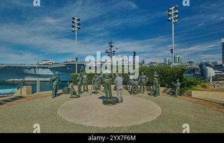 The USS Midway Museum and Unconditional Surrender  Statue (sculpture) in San Diego, California, USA Stock Photo