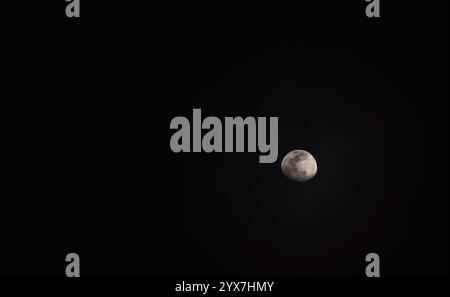 half moon floating on sky in night Stock Photo