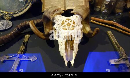 Stockholm, Sweden, December 7, 2024. A carved ram skull and crucifixes on display at the city center's history museum. Stock Photo