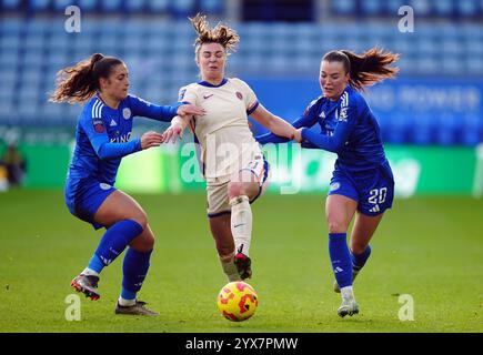 Chelsea's Niamh Charles (centre) is challenged by Leicester City's Missy Goodwin (right) and Julie Thibaud during the Barclays Women's Super League match at the King Power Stadium, Leicester. Picture date: Saturday December 14, 2024. Stock Photo