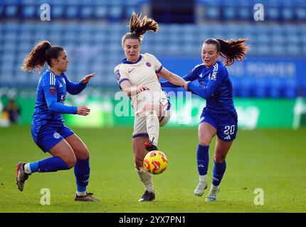 Chelsea's Niamh Charles (centre) is challenged by Leicester City's Missy Goodwin (right) and Julie Thibaud during the Barclays Women's Super League match at the King Power Stadium, Leicester. Picture date: Saturday December 14, 2024. Stock Photo