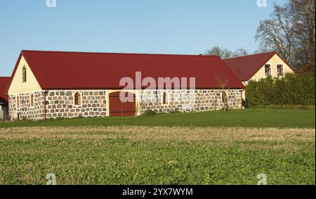 Stables with granite stone walls on a farm in Skivarp, Skurup municipality, Skane county, Sweden, Scandinavia, Europe Stock Photo