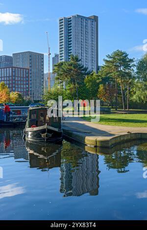 The Oxygen Tower apartment block from the Cotton Field Park marina, New Islington, Ancoats, Manchester, England, UK Stock Photo