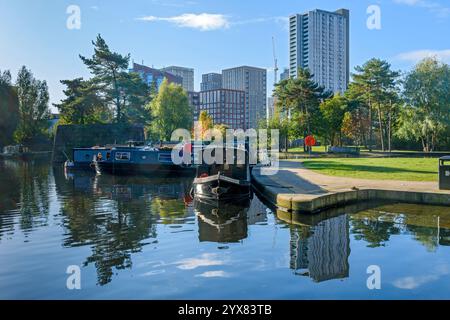 The Oxygen Tower apartment block from the Cotton Field Park marina, New Islington, Ancoats, Manchester, England, UK Stock Photo