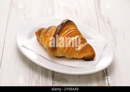 croissant isolated on white plate Stock Photo