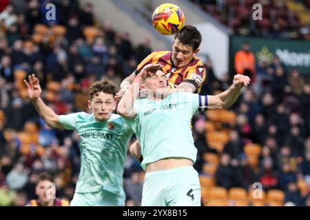 Bradford, UK. 14th Dec, 2024. Valley Parade, Bradford, England, December 14th 2024: Andy Cook (9 Bradford City) heads the ball during the EFL Sky Bet League Two match between Bradford City and Swindon Town at Valley Parade in Bradford, England on December 14th 2024. (Sean Chandler/SPP) Credit: SPP Sport Press Photo. /Alamy Live News Stock Photo