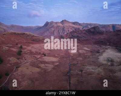 Beautiful atmospheric aerial drone Autumn landscape image of Langdale Pikes in Lake District Stock Photo