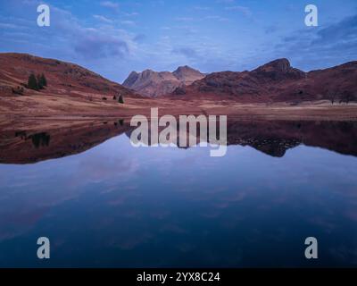 Beautiful atmospheric aerial drone Autumn landscape image of Langdale Pikes in Lake District Stock Photo