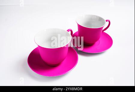 two pink ceramic Cup on white background, isolated Stock Photo