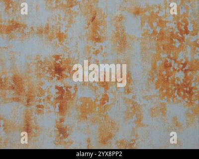 orange rust on light gray metal surface as abstract texture grunge background, metal corrosion fragment of iron sheet Stock Photo