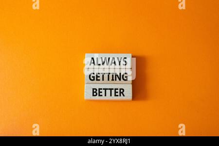 Always getting better symbol. Wooden blocks with words Always getting ...