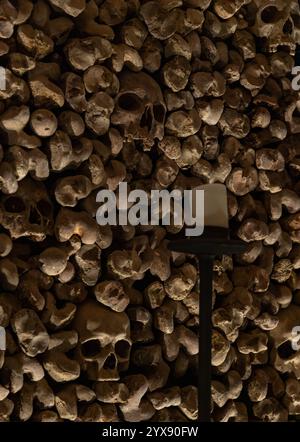 A picture of multiple skulls and bones at the Brno Ossuary. Stock Photo