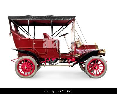 Red 1908 McLaughlin-Buick Model F antique vintage retro car side view isolated on white background with clipping path Stock Photo