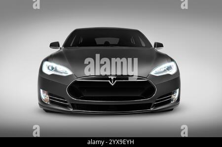 Gray 2017 Tesla Model S luxury electric car front view isolated on gray background with clipping path Stock Photo