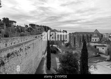 Girona, Catalonia, Spain - FEB 12, 2022: Ancient city walls of Girona, one of the most complete city walls in Europe. Stock Photo