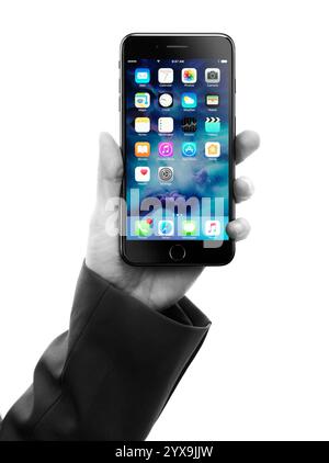 Woman hand holding Apple iPhone 7 Plus isolated on white background artistic black and white Stock Photo