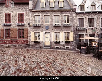 Galerie Place Royale and restaurant La Pizz in Royal Square on a rainy day. Beautiful historic architecture, French style houses in Old Quebec City. Q Stock Photo