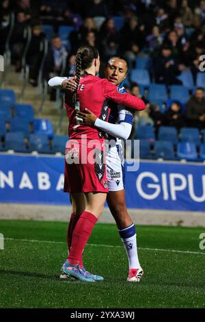 Female soccer players embracing Stock Photo - Alamy