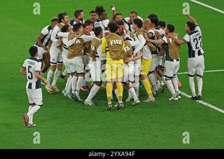 Doha, Qatar. 14th Dec, 2024. Players of C.F. Pachuca celebrate their victory with the trophy following the penalty shootout during the FIFA Challenger Cup and FIFA Intercontinental Cup football match between Mexico's Pachuca and Egypt's Al-Ahly, at 974 Stadium, in Doha, Qatar, on December 14, 2024. Photo: Ahmed Alsaidi/DiaEsportivo/Alamy Live News Credit: DiaEsportivo/Alamy Live News Stock Photo