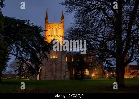 Pershore Abbey Church of the Holy Cross at dusk in December. Pershore, Worcestershire, England Stock Photo