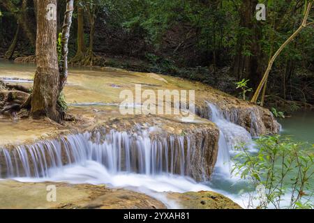 Erawan Waterfall in the rainforest in north of Kanchanaburi, Thailand Stock Photo
