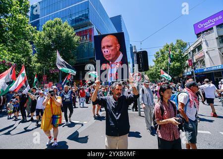 Melbourne, Australia. 15th Dec, 2024. Flags and banners fill Melbourne's streets as protestors march through the CBD. Protesters wave Palestinian flags and hold banners calling for an end to genocide and Zionist aggression, chanting in solidarity for Palestinian liberation and justice. (Photo by Ye Myo Khant/SOPA Images/Sipa USA) Credit: Sipa USA/Alamy Live News Stock Photo