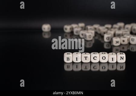 Bitcoin in Cubes: Word Composed with Wooden Letters on Black Background. Cryptocurrency, Virtual Currency and Payment System. Stock Photo