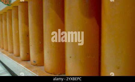 Background decoration in a restaurant, abstrac decoration mini pole standing parallel in near the table Stock Photo