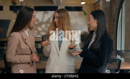 Happy smiling laughing joyful positive friendly business women people colleagues females multiracial multiethnic girls businesswomen diversity Stock Photo